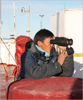 Marine Mammal Observer Nelson Ruben on watch (photo Don Glencross)