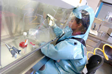 A scientist works in the Level 4 laboratory at the NML